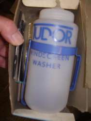 washer bottle mounting