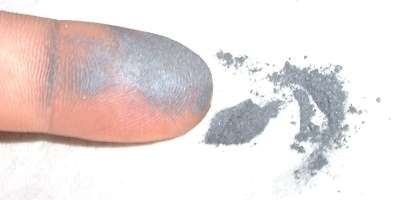Moly powder on finger
